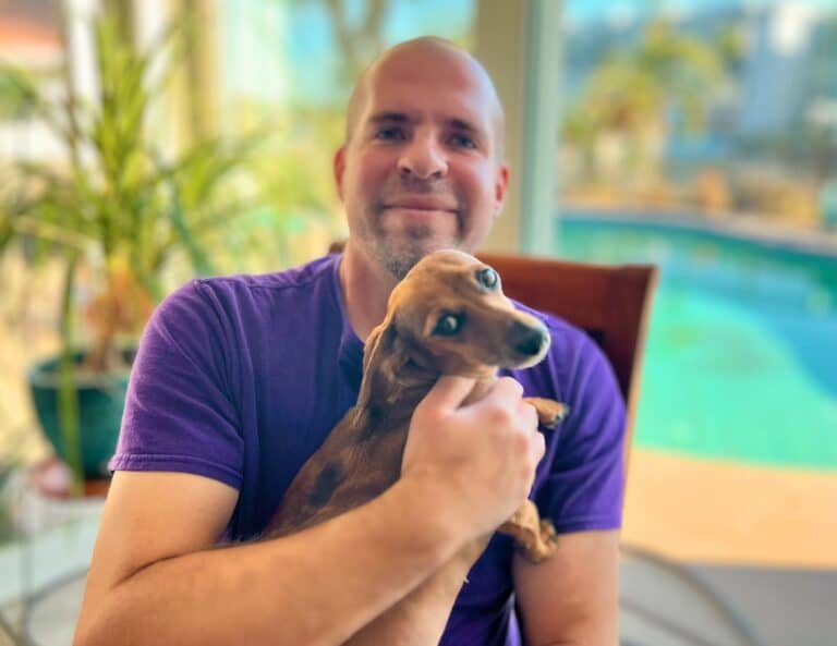 Ben holding one of his dog
